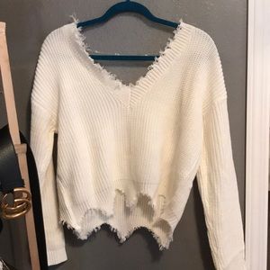 Distressed white sweater